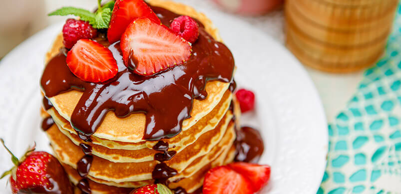 Tasty pancakes with Chocolate Syrup.